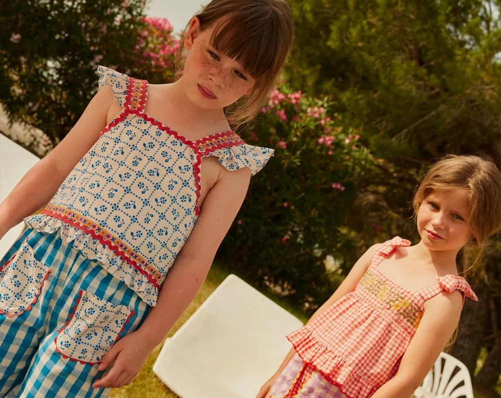 An escape into the heart of folklore with embroidered pieces, natural materials, and silhouettes full of poetry.